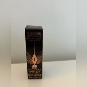 Charlotte Tilbury Airbrush Flawless Setting Spray 15ml travel size.